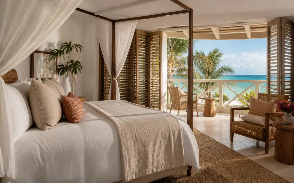 A calm island bedroom opening onto turquoise water.